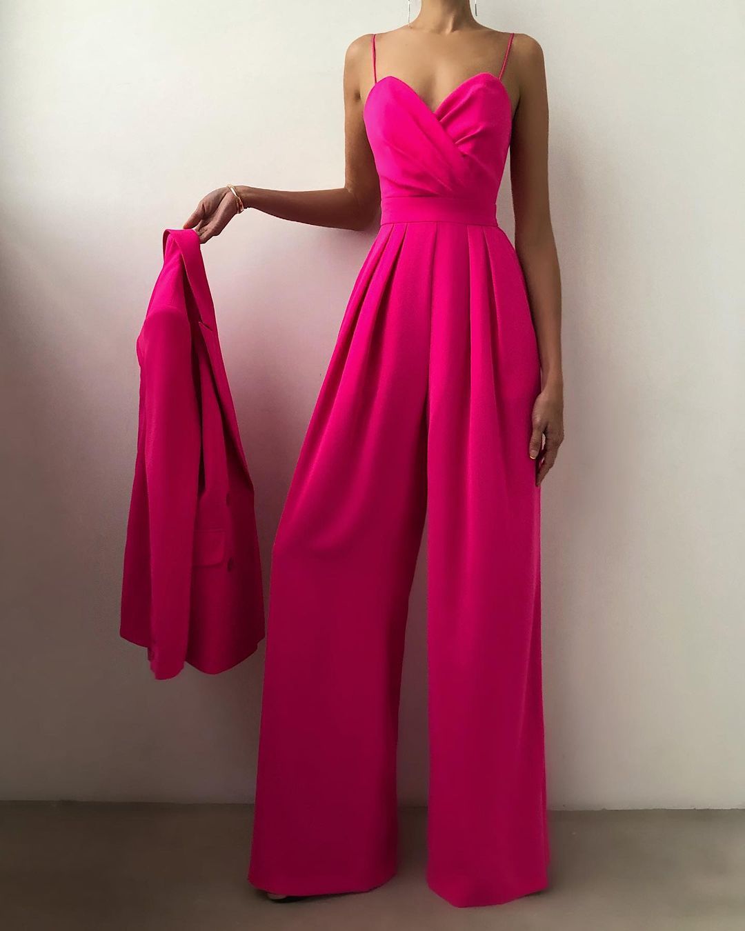 Livia black wide-leg jumpsuit with chic strappy neckline and flowing elegant silhouette