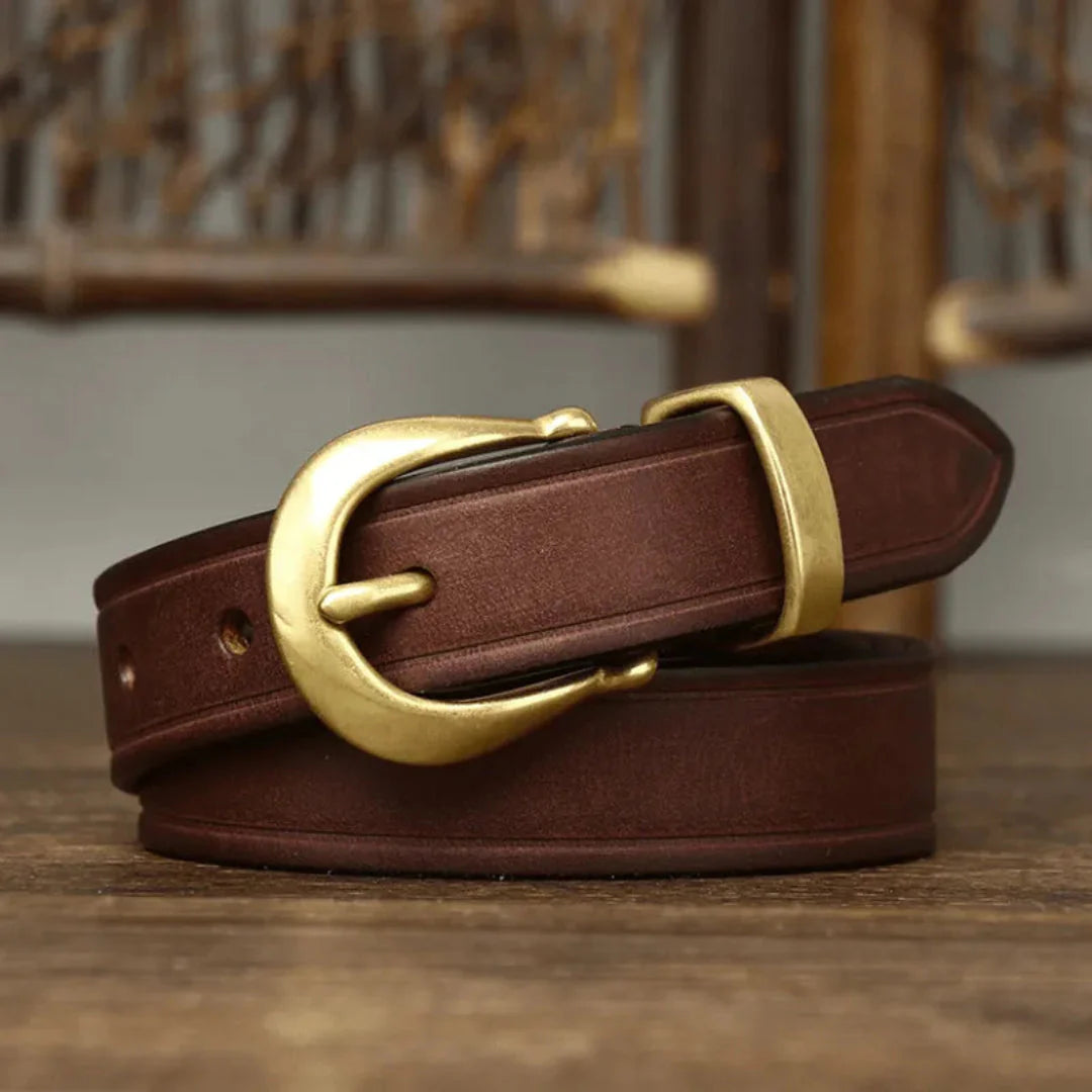 Wania slim full-grain leather belt unisex everyday style with distinctive curved brass buckle