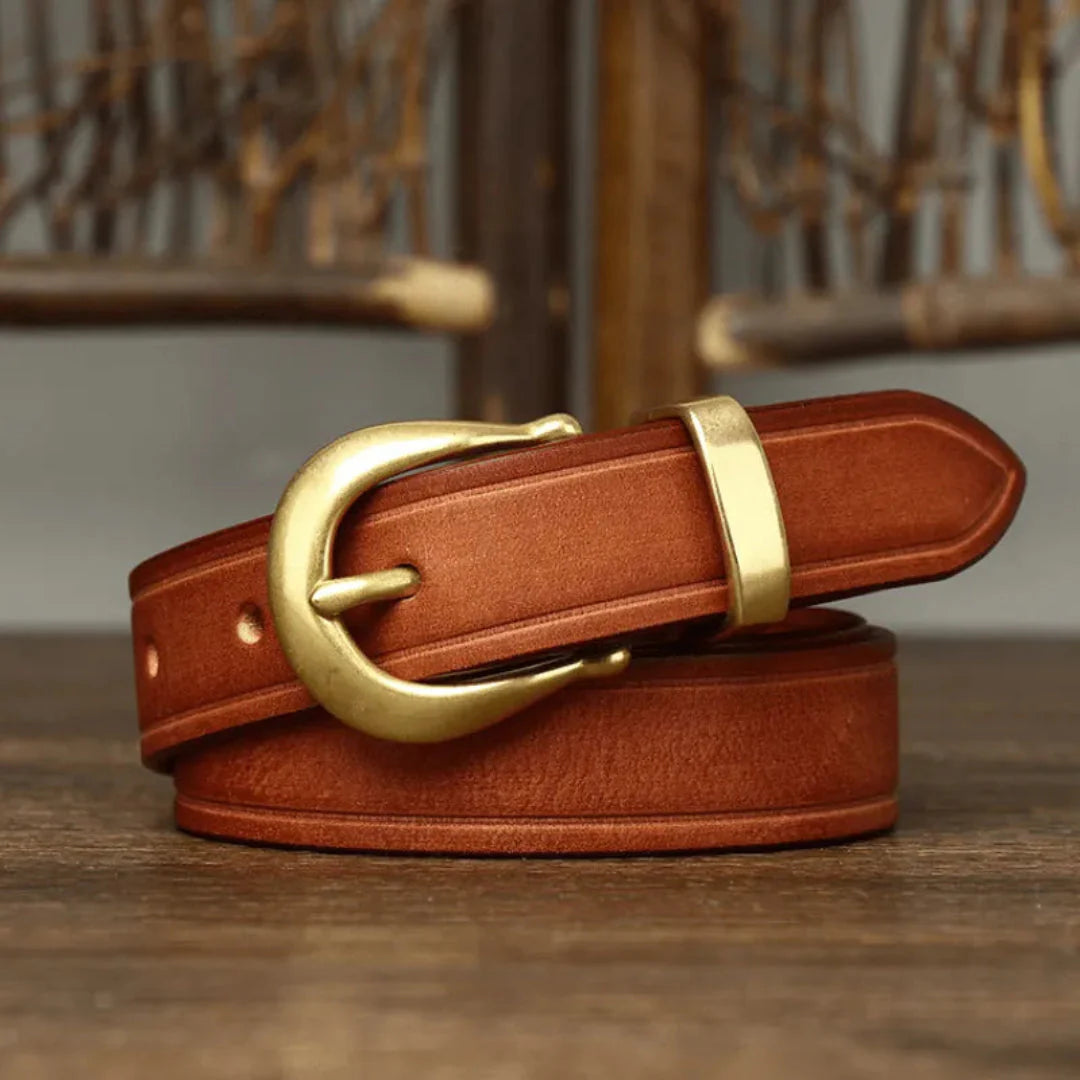 Wania slim full-grain leather belt with curved brass buckle, unisex timeless everyday style