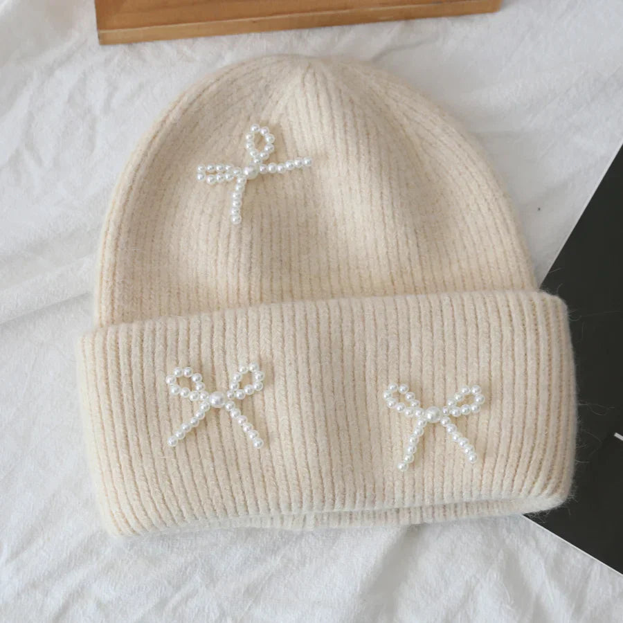 Women's cozy acrylic knitted winter hat with fashionable silhouette for superior cold weather comfort