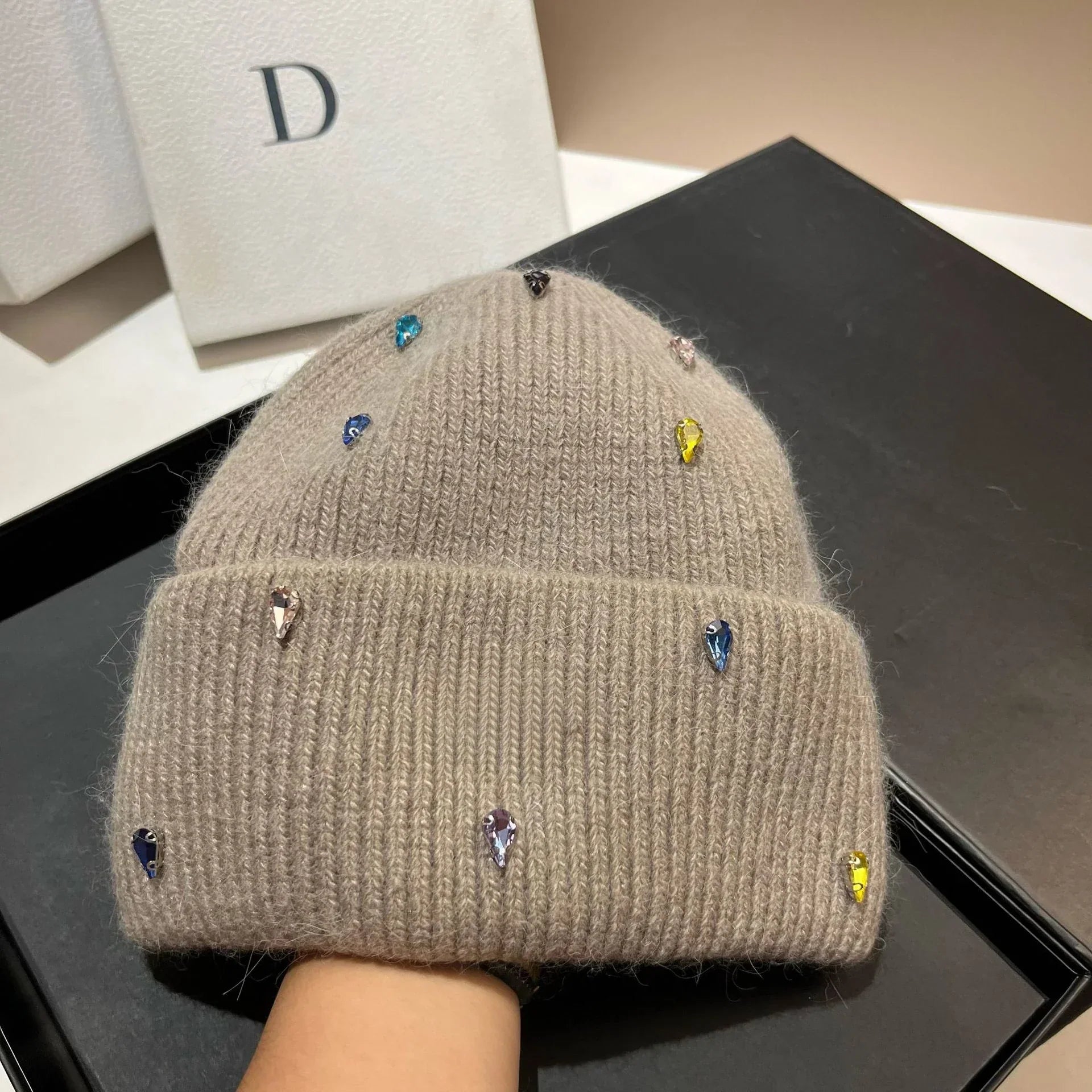 Women's cozy acrylic knitted winter hat with fashionable silhouette for superior cold weather warmth
