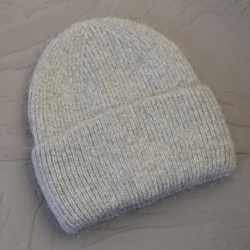 Women's cozy acrylic knitted winter hat with fashionable urban silhouette for cold weather comfort