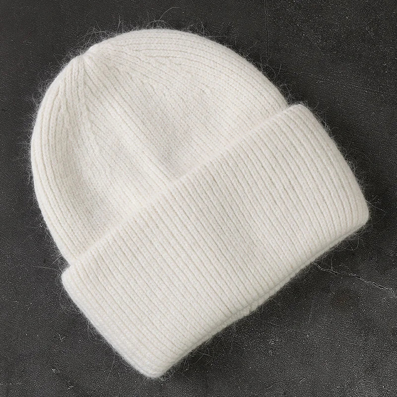 Women's cozy acrylic knitted winter hat in neutral tones with fashionable ribbed silhouette