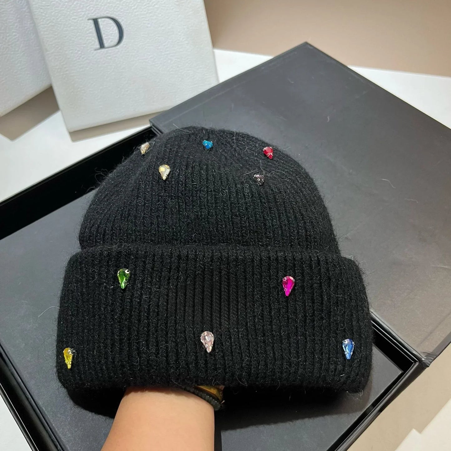 Women's cozy acrylic knitted winter hat with fashionable urban silhouette for cold weather