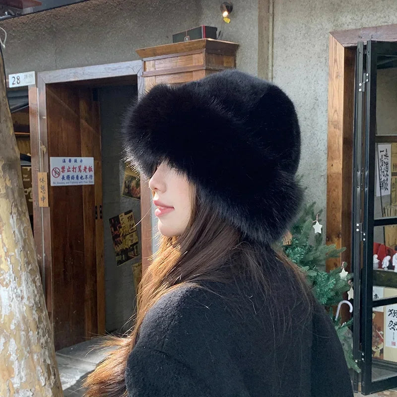 Women's faux fur winter hat in plush rimless silhouette for skiing and outdoor activities