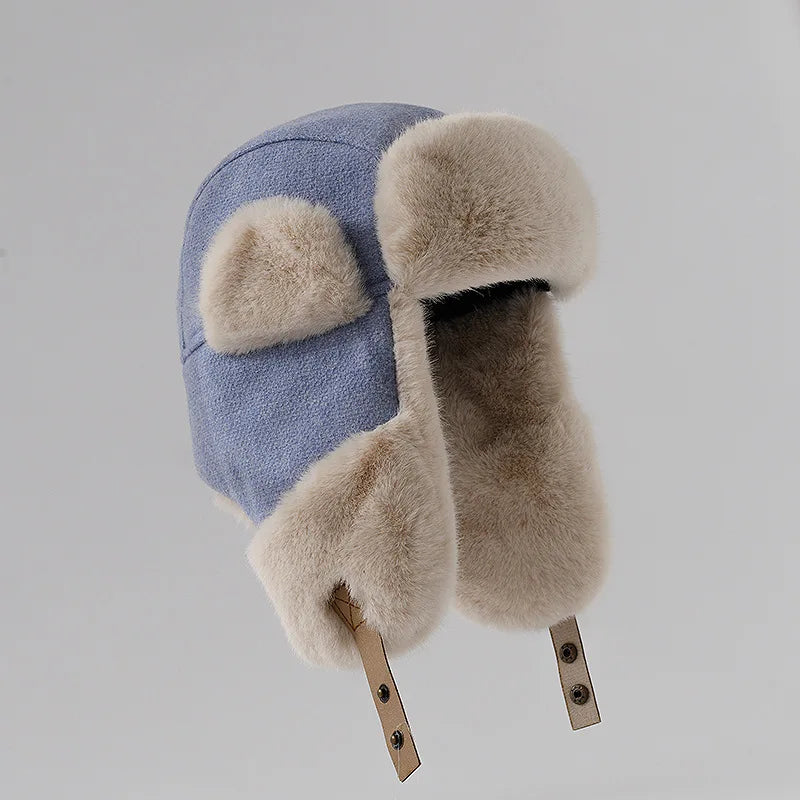 Women's blue faux fur plush winter hat with cozy Nerk lining for cycling and skiing outdoors