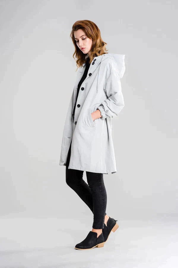 Women's waterproof hooded jacket sleek silhouette moisture-resistant all-weather layering piece