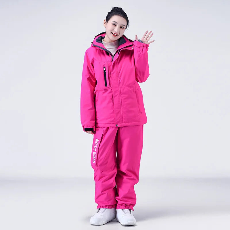 Women's waterproof ski suit with bib pants and suspenders, breathable lightweight design for skiing
