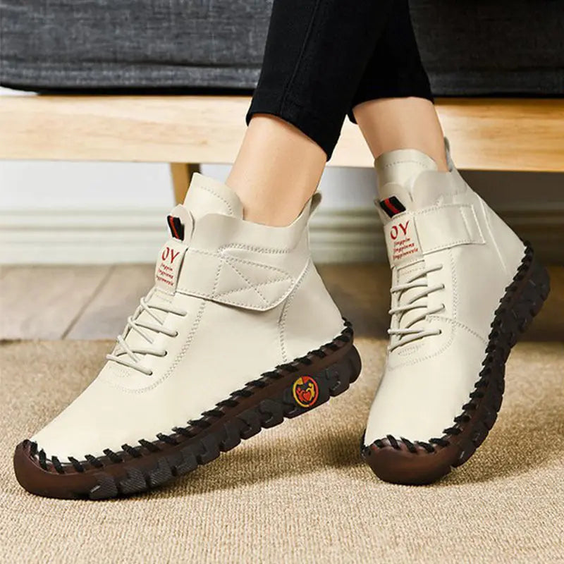 Women's waterproof lace-up boots with warm PU lining, stylish all-weather winter ankle design