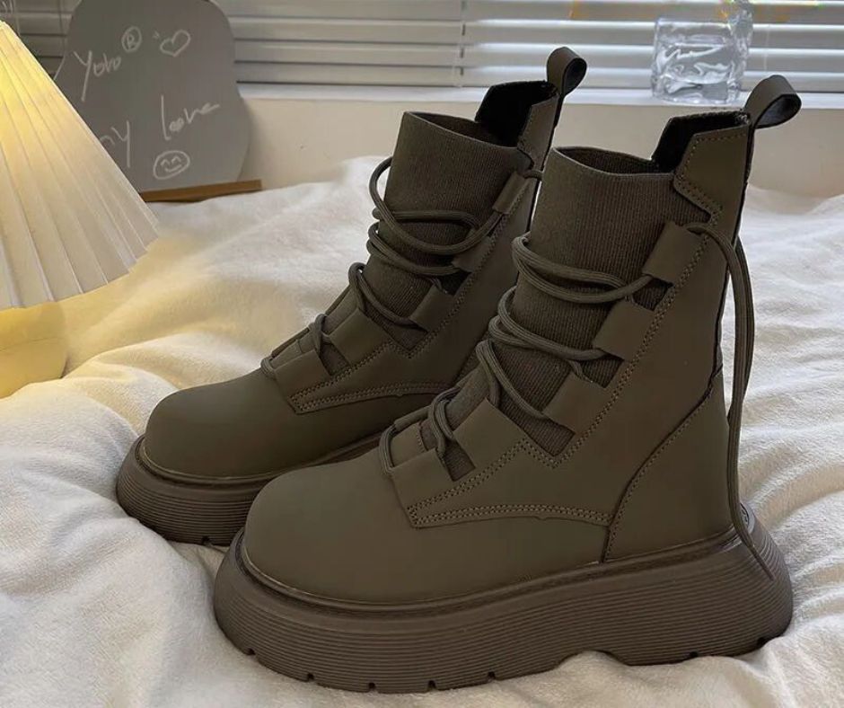 Women's black leather-look winter boots with textile panels, stylish cut for city commutes and office wear