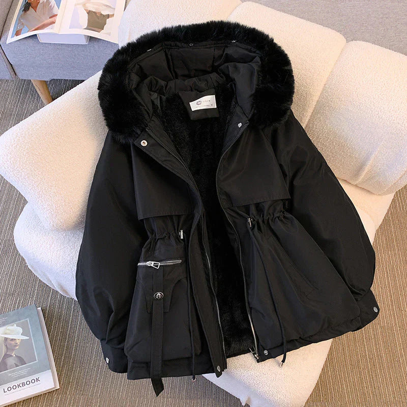 Women's olive green parka jacket with fur-trim hood, adjustable waist, and water-repellent winter finish