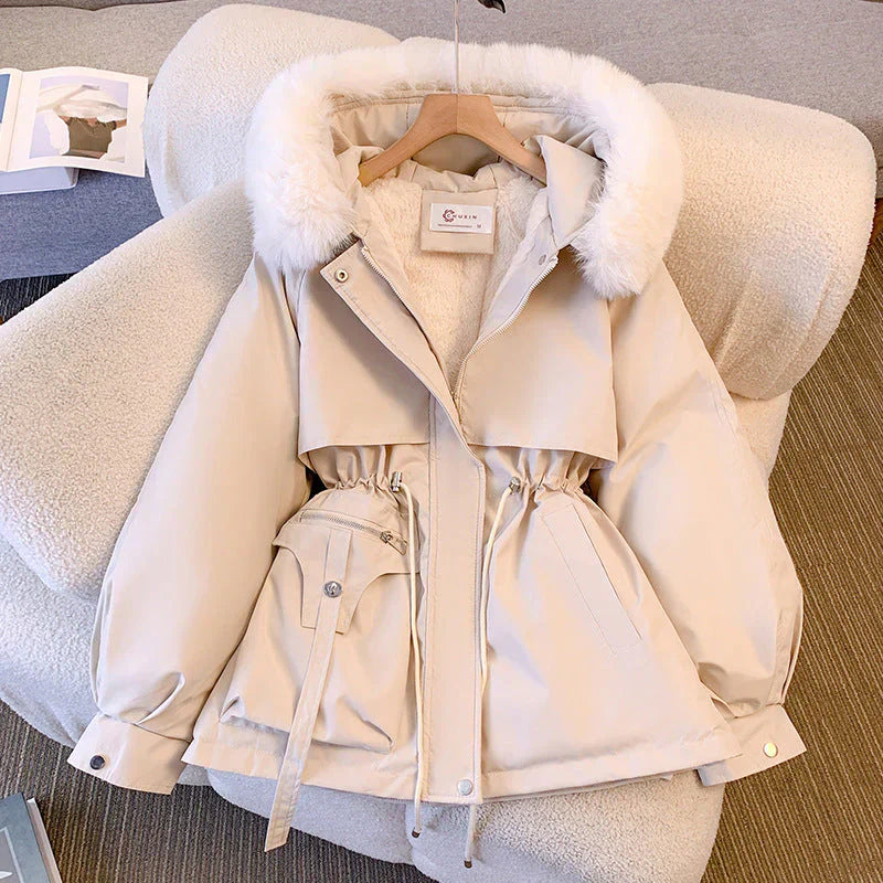 Women's olive green parka jacket with water-repellent finish, adjustable waist, fur-trimmed hood