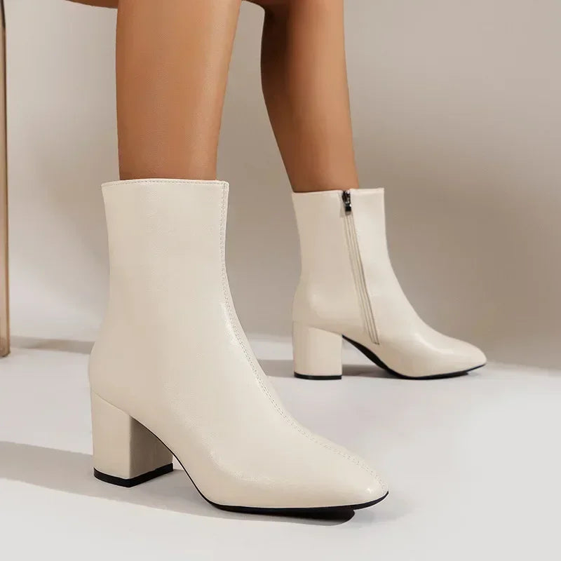 Women's black block heel ankle boots with sleek silhouette and convenient side zipper closure