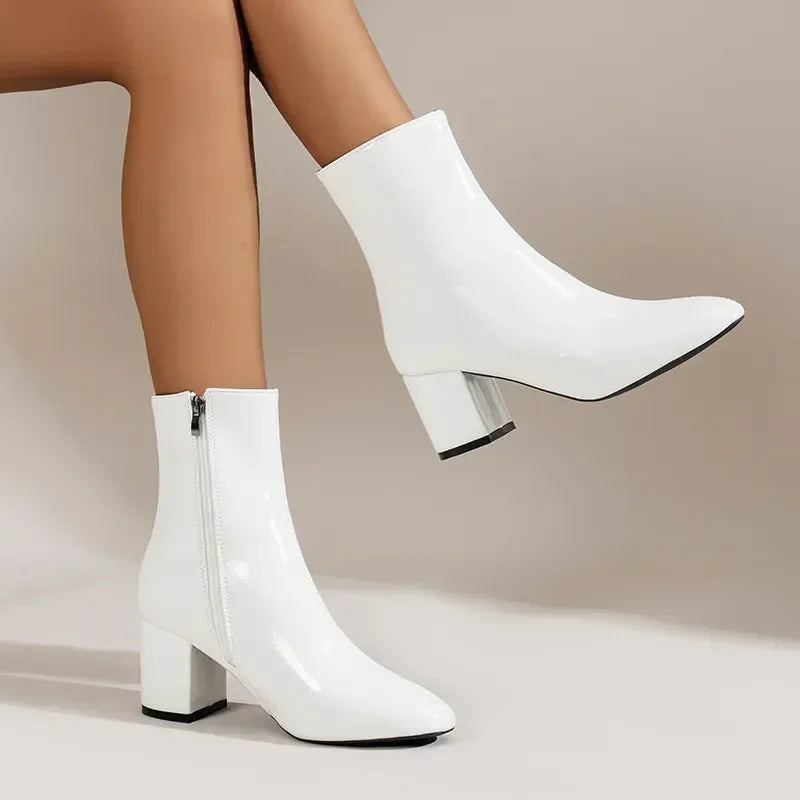 Women's black block heel ankle boots with sleek silhouette and convenient side zipper closure