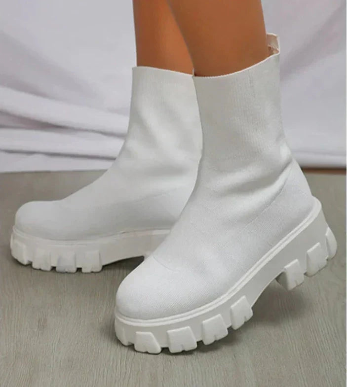 Women's slip-on chunky heel boots with stretch upper and lug sole for bold casual city style