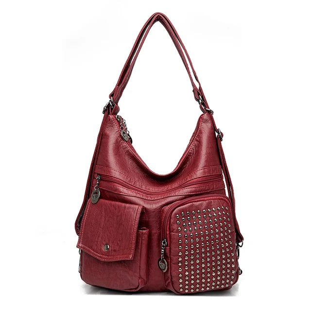 Vintage brown studded PU leather backpack with compact silhouette and multiple pockets