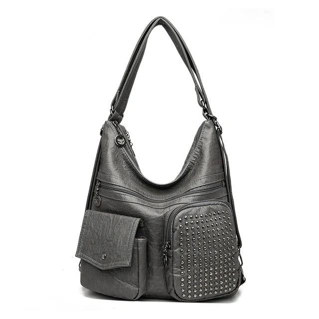 Vintage brown studded PU leather backpack with compact design and multiple pockets for travelers