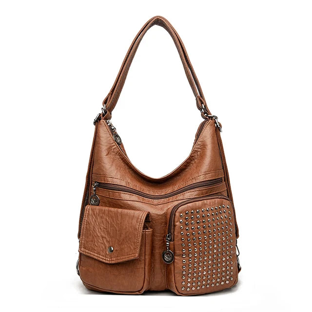 Vintage brown studded PU leather backpack with compact silhouette and multiple pockets