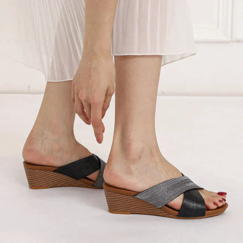 Women's slip-on wedge sandals with open toe, crisscross straps, and supportive sole for everyday comfort