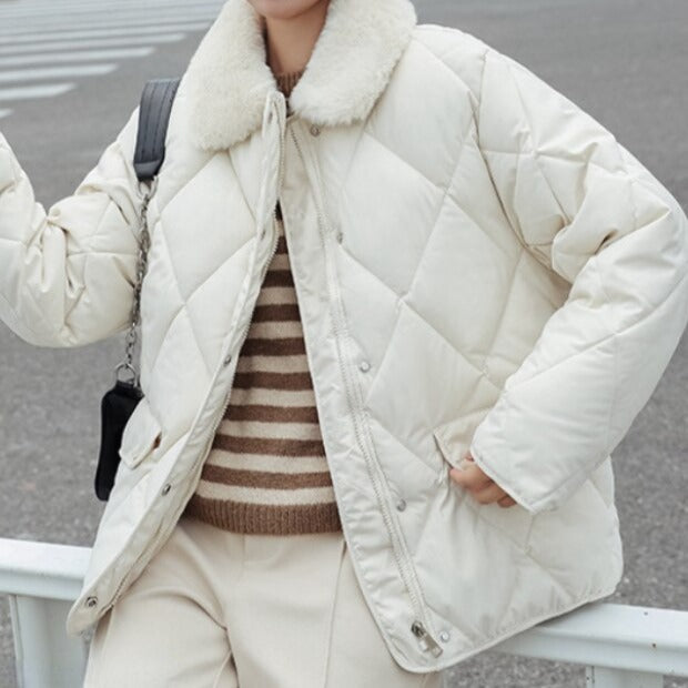Women's black quilted windproof jacket hip-length cozy fit with sporty feminine silhouette