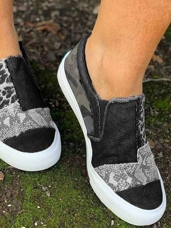Women's white slip-on platform sneakers with clean minimalist design for all-day comfort