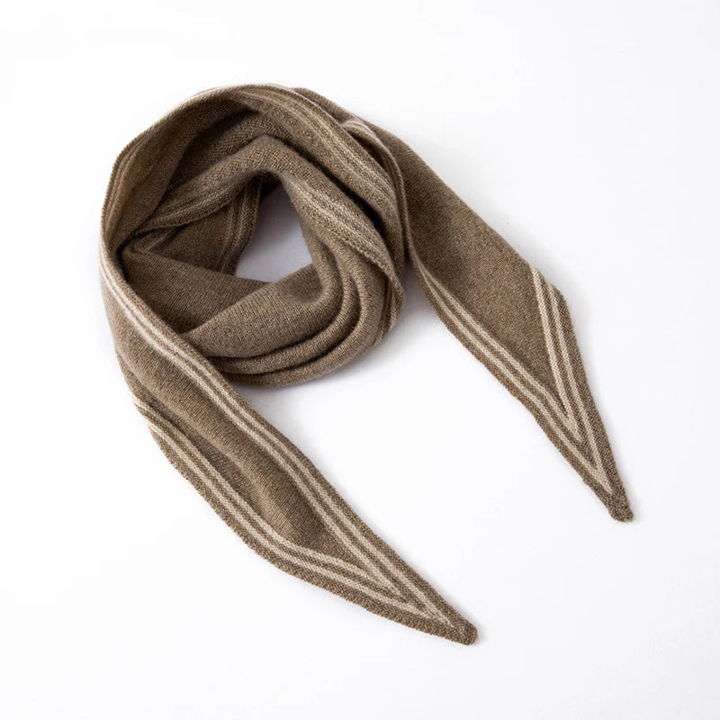 Women's beige cashmere knit scarf with contrast stripe trim, elongated slim profile for wrapping