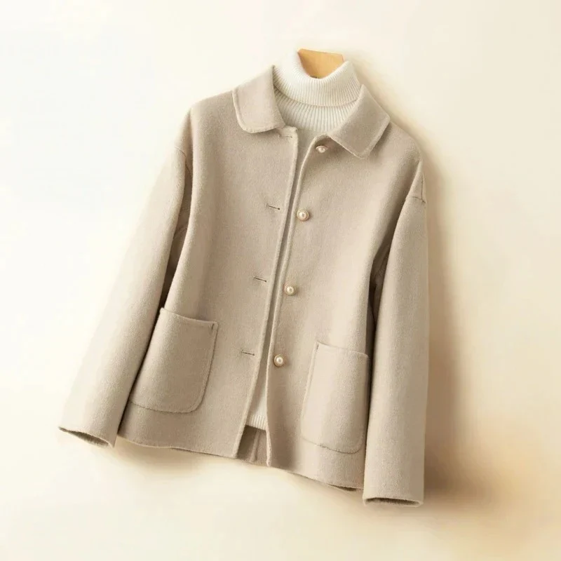 Women's hip-length double-sided wool coat with elegant rounded collar in classic fall style