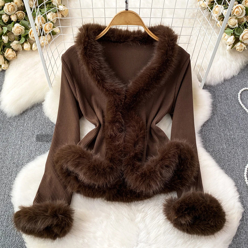 Women's ribbed top with faux fur trim V-neck neckline and cuffs, elegant hip-length evening wear