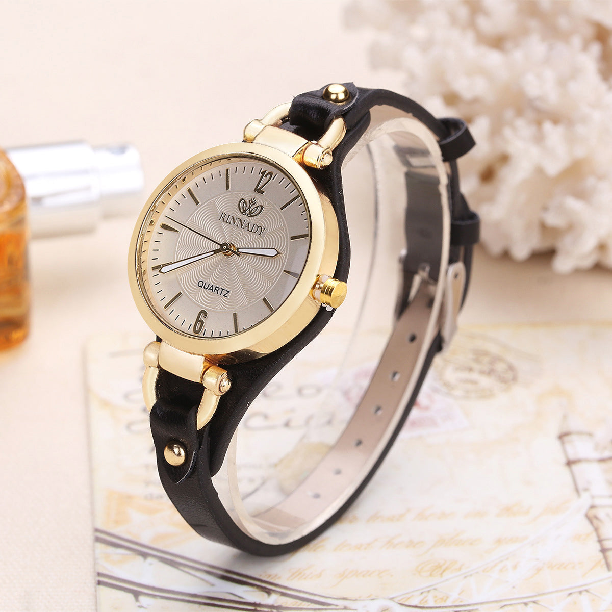 Isla faux leather wristwatch adjustable strap gold-tone bezel round dial elegant women's timepiece