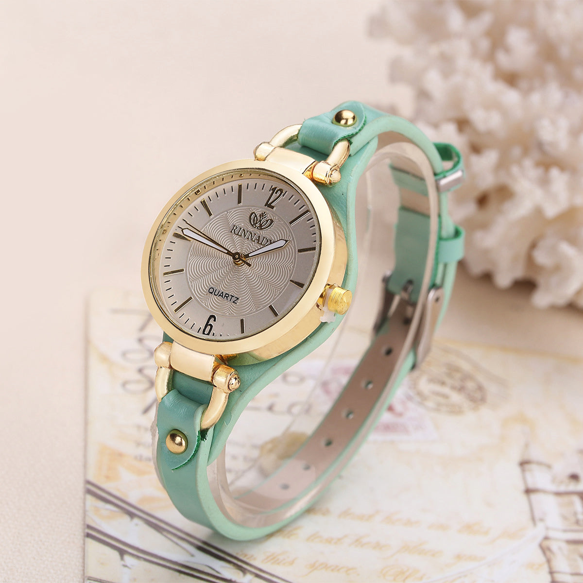 Isla faux leather wristwatch with adjustable strap, gold-tone bezel, round dial, everyday elegance