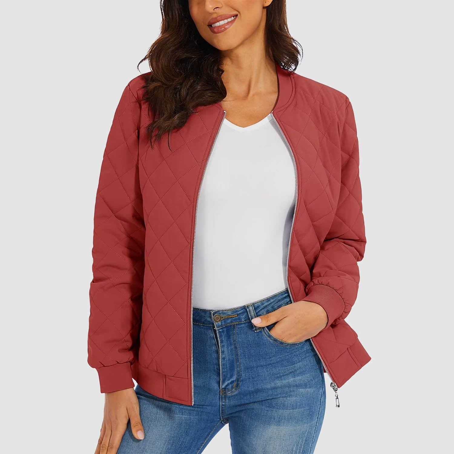 Women's black quilted bomber jacket with diamond stitching, windproof zipper, and dual zip pockets