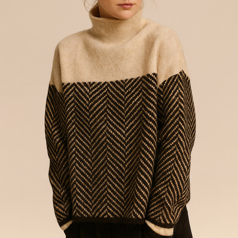 Women's beige chevron knit turtleneck sweater relaxed silhouette dropped shoulders hip-length