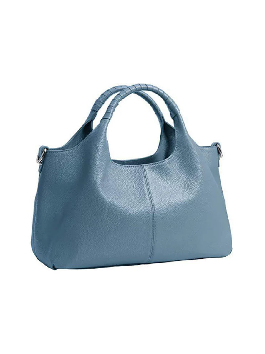 Women's black PU leather luxury handbag with spacious interior and secure zipper closure