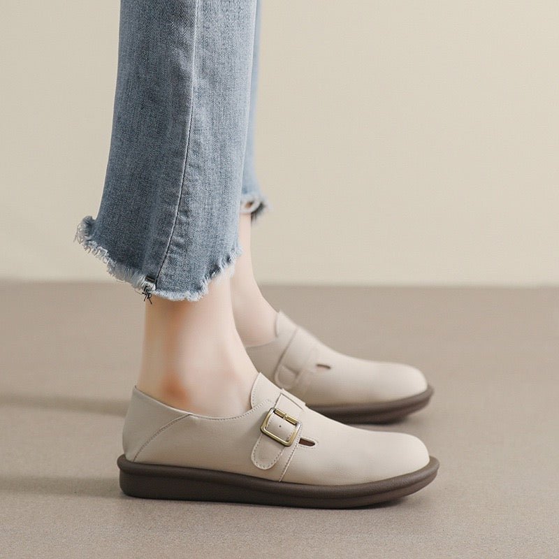 Women's black Mary Jane loafers with round toe, cushioned footbed arch support, and classic flat sole