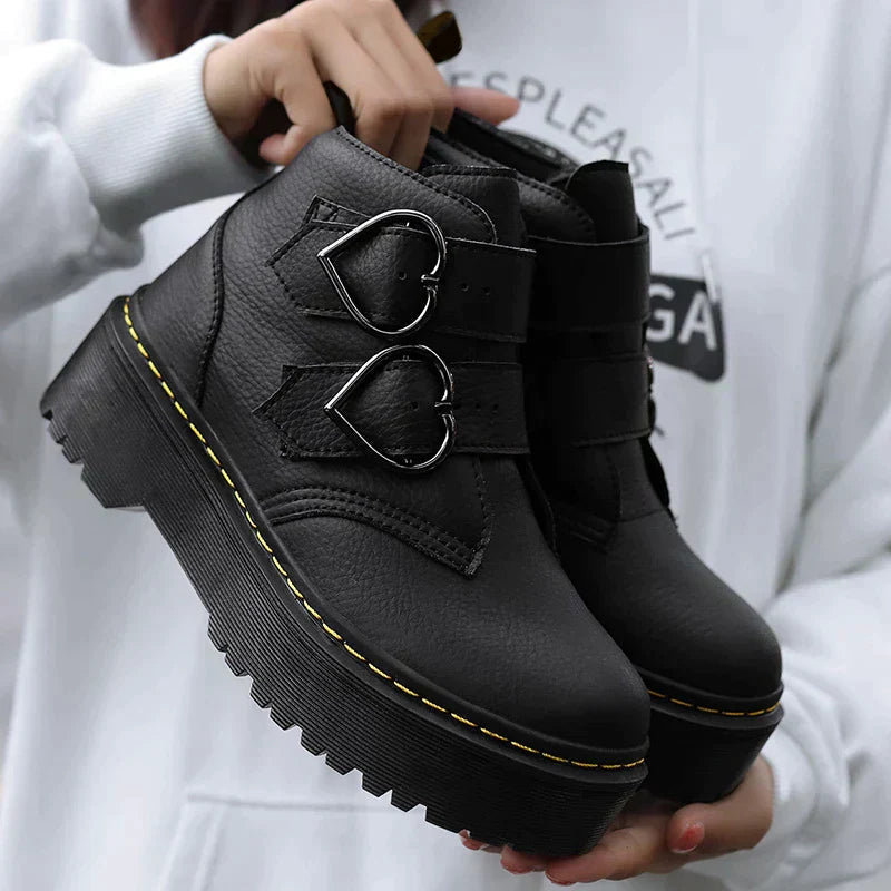 Women's black chunky sole street boots with edgy silhouette and bold platform for urban style