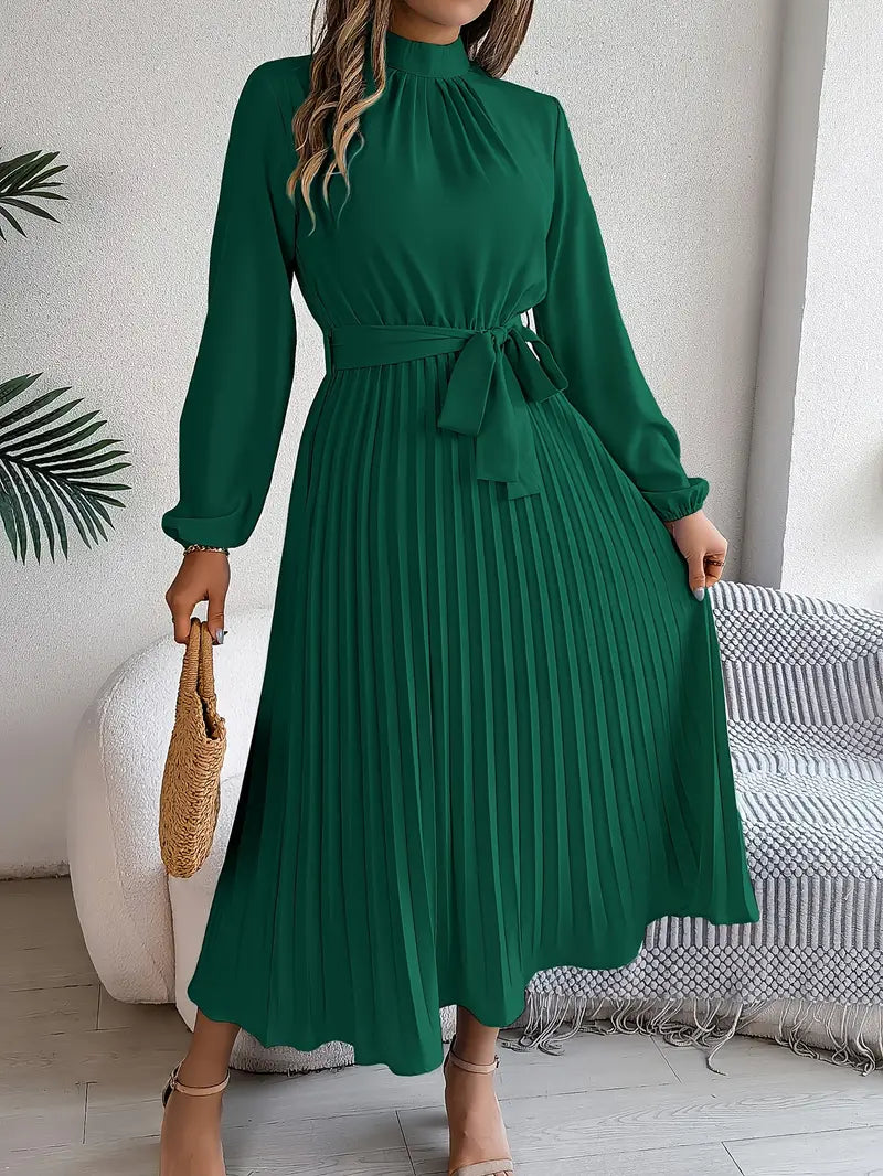 Light blue pleated midi dress with belted waist, high neckline and long sleeves for elegant wedding guest