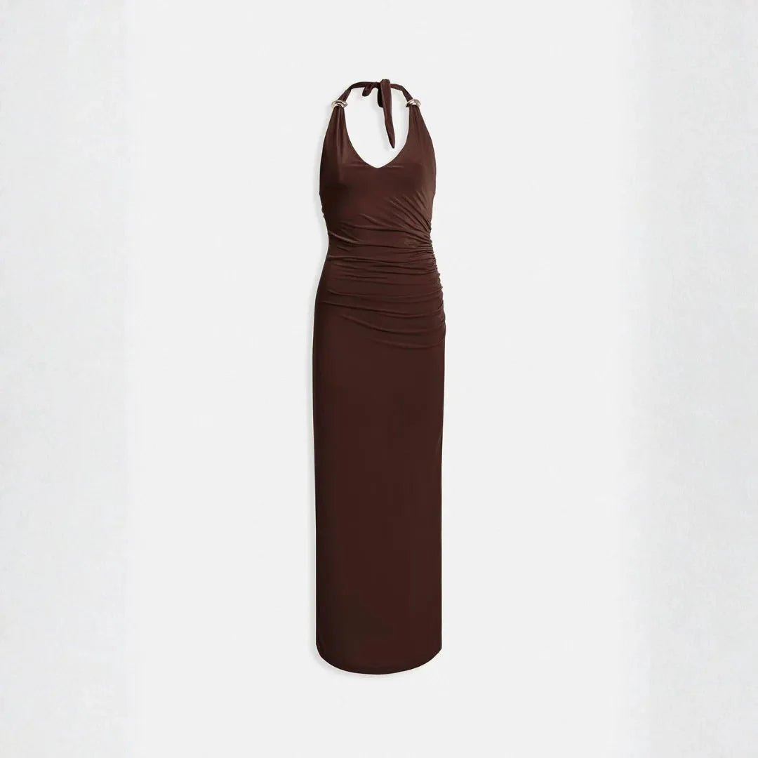Women's black halter maxi dress with ruched fit and gold ring strap accents for elegant evenings