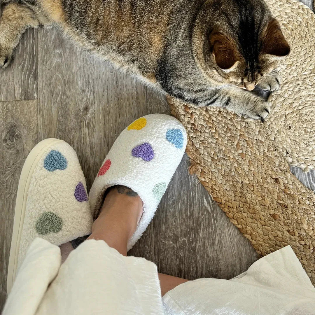 Women's white plush sherpa slippers with pastel embroidered hearts and non-slip sole