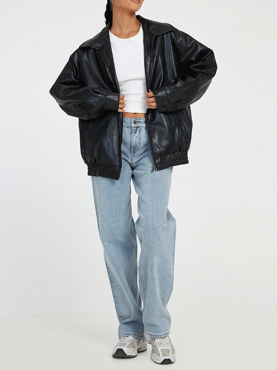 Women's black faux leather oversized bomber jacket with zip front and elastic hem