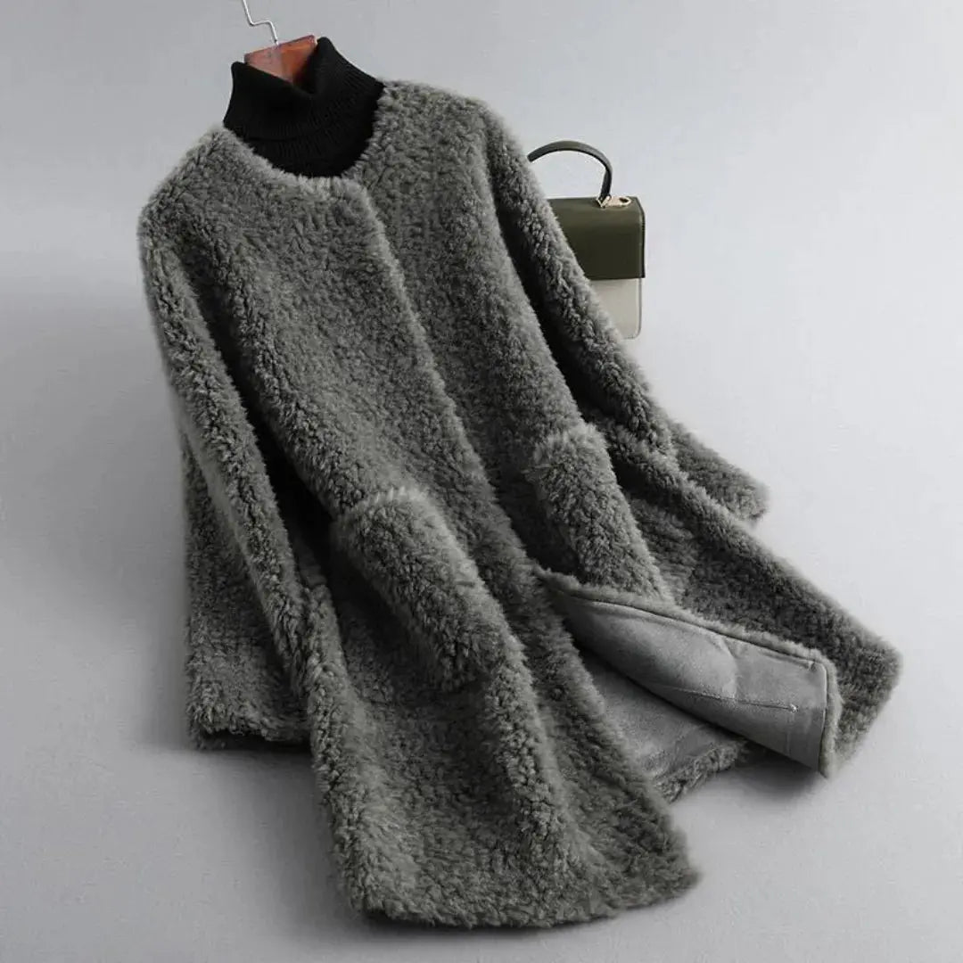 Women's shearling fur coat in plush ultra-soft texture with elegant draped design for luxurious warmth