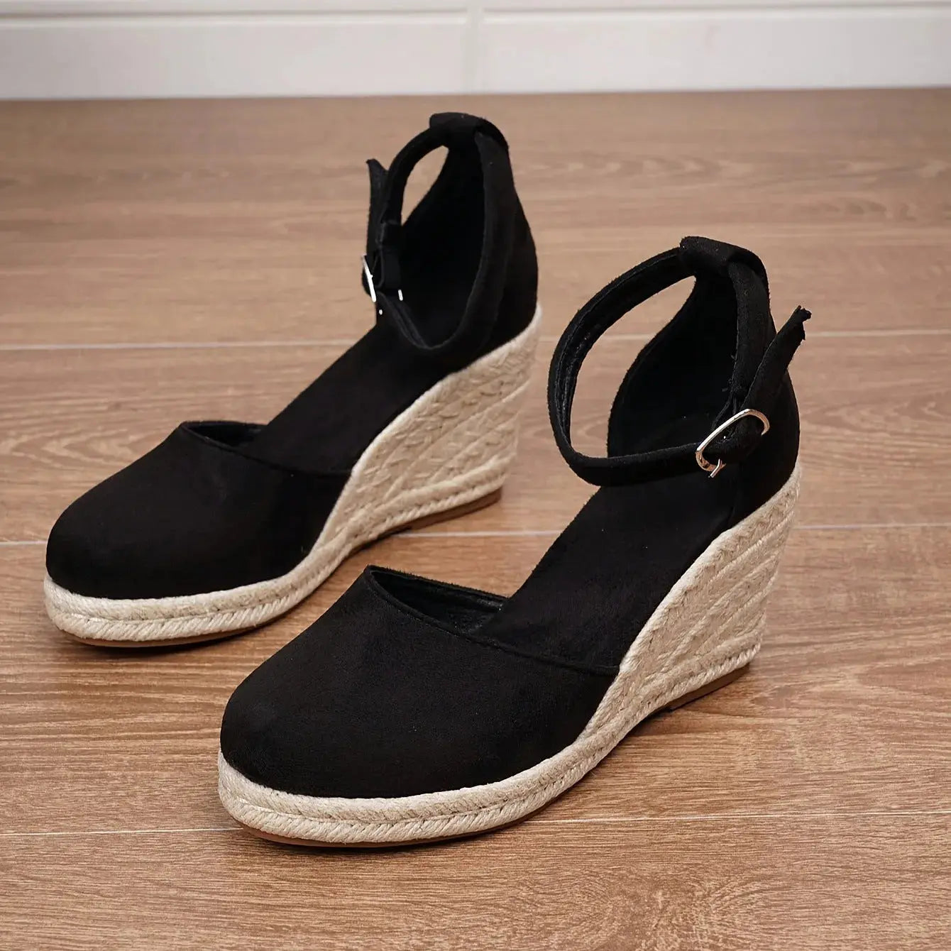 Women's closed-toe espadrille wedge sandal with ankle strap and braided jute sole in neutral tone