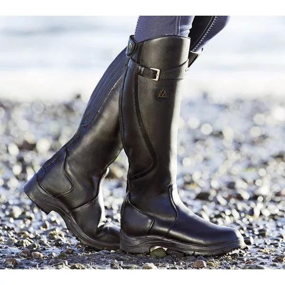 Women's waterproof full-grain leather riding boots with adjustable side straps and rugged grip sole