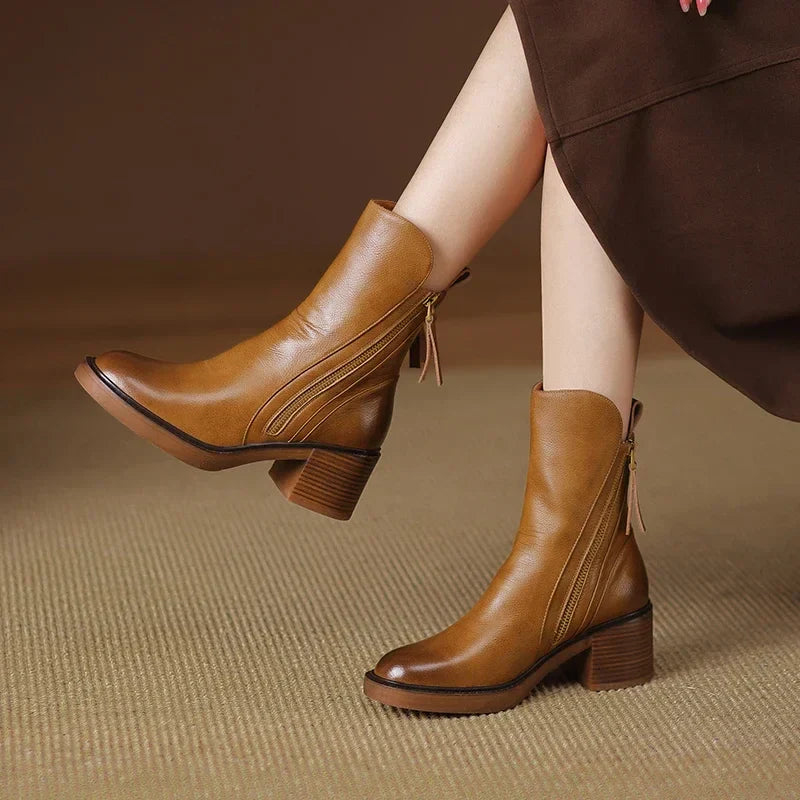 Black faux leather ankle boots with block heel, dual zippers, chic everyday style