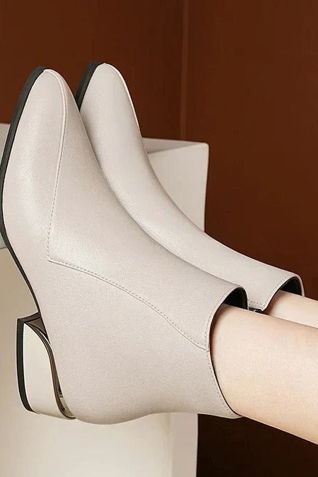 Women's black block heel boots with side zipper closure, sleek streamlined silhouette for everyday elegance