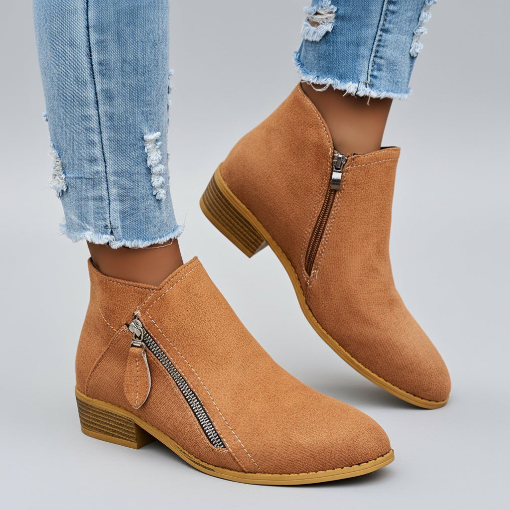 Women's black ankle boots with side zip closure, stacked low heel, sleek silhouette for casual wear