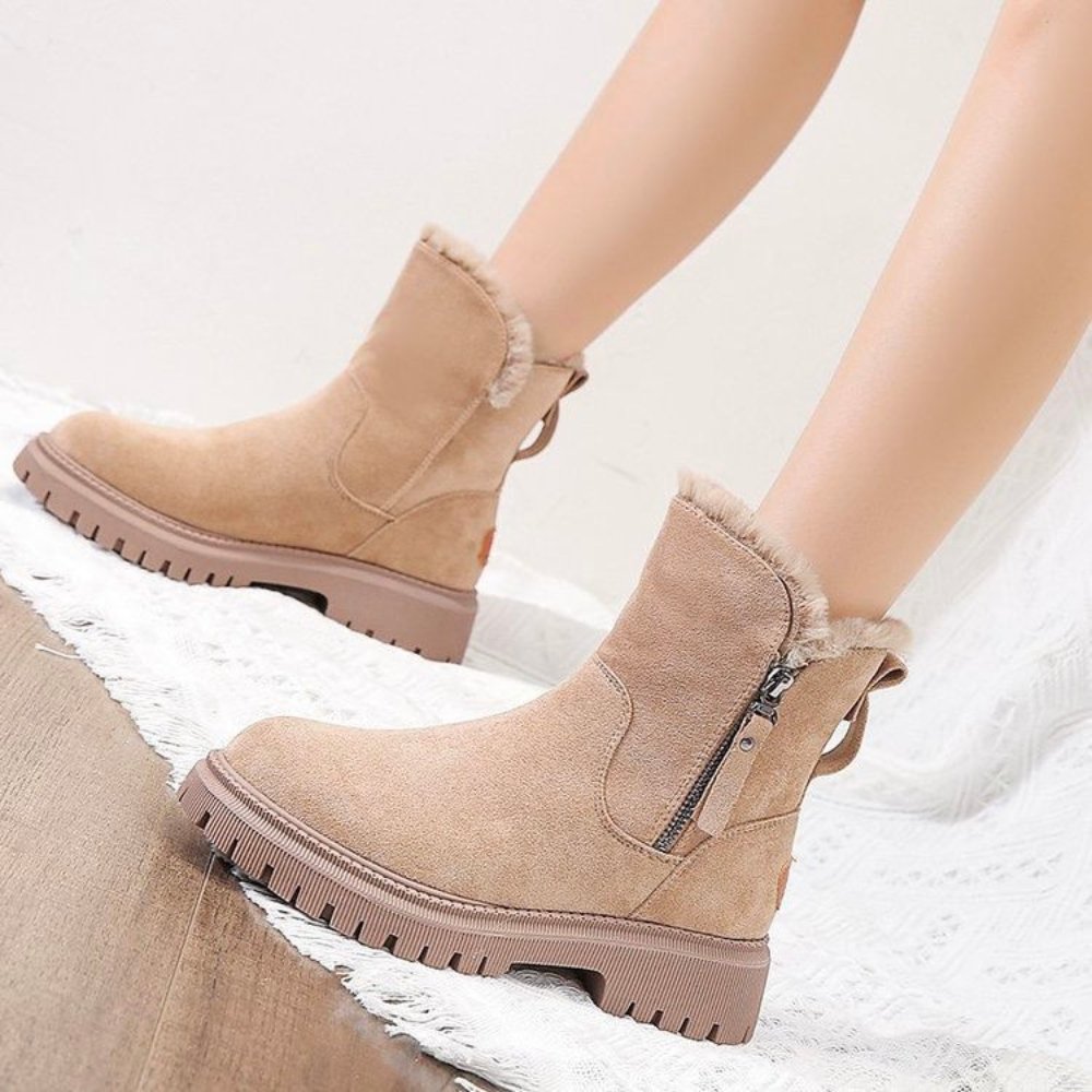 Women's black suede-look ankle boots with faux fur lining, side zip, and rugged lug sole