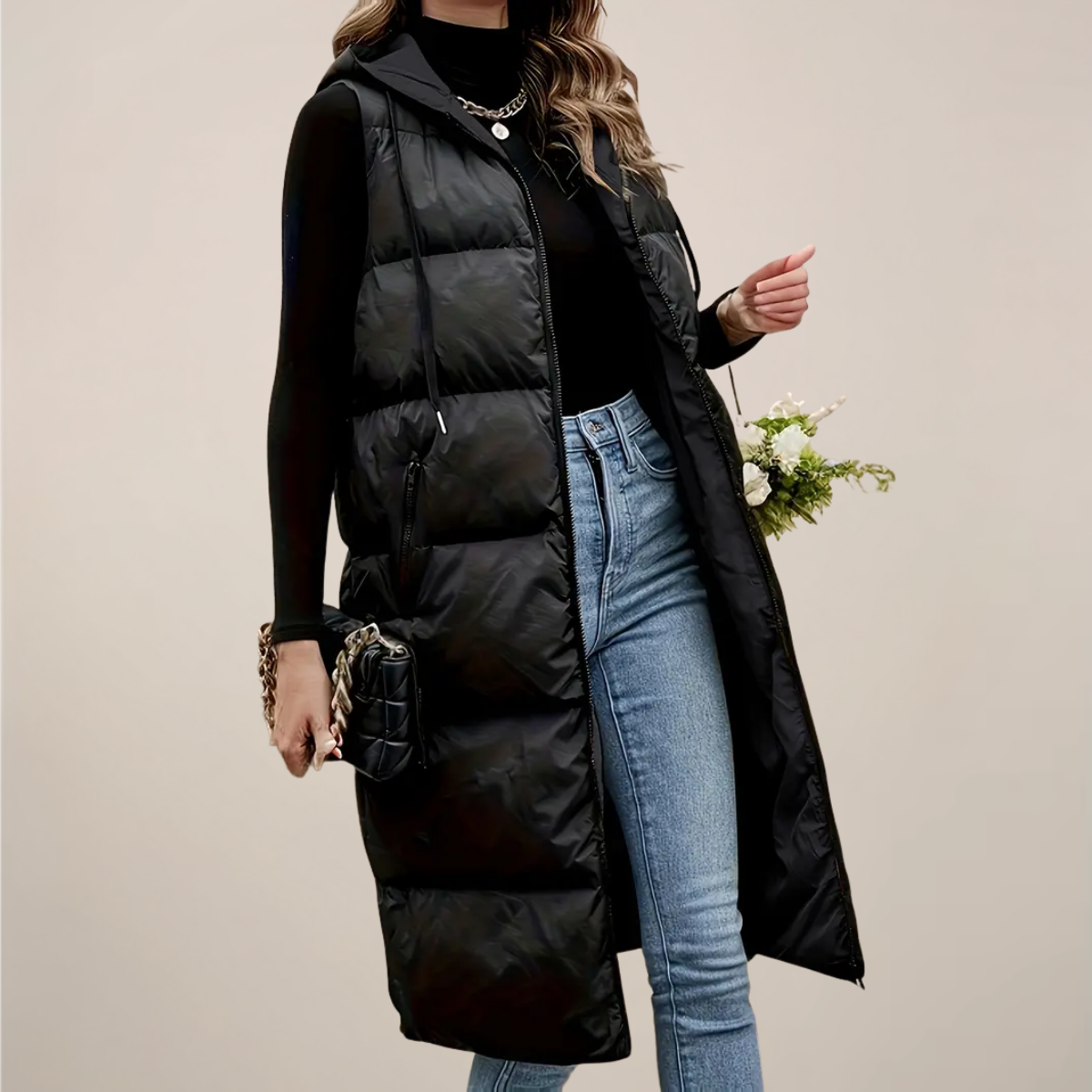 Women's black longline hooded puffer gilet sleeveless with horizontal quilting and zipped pockets