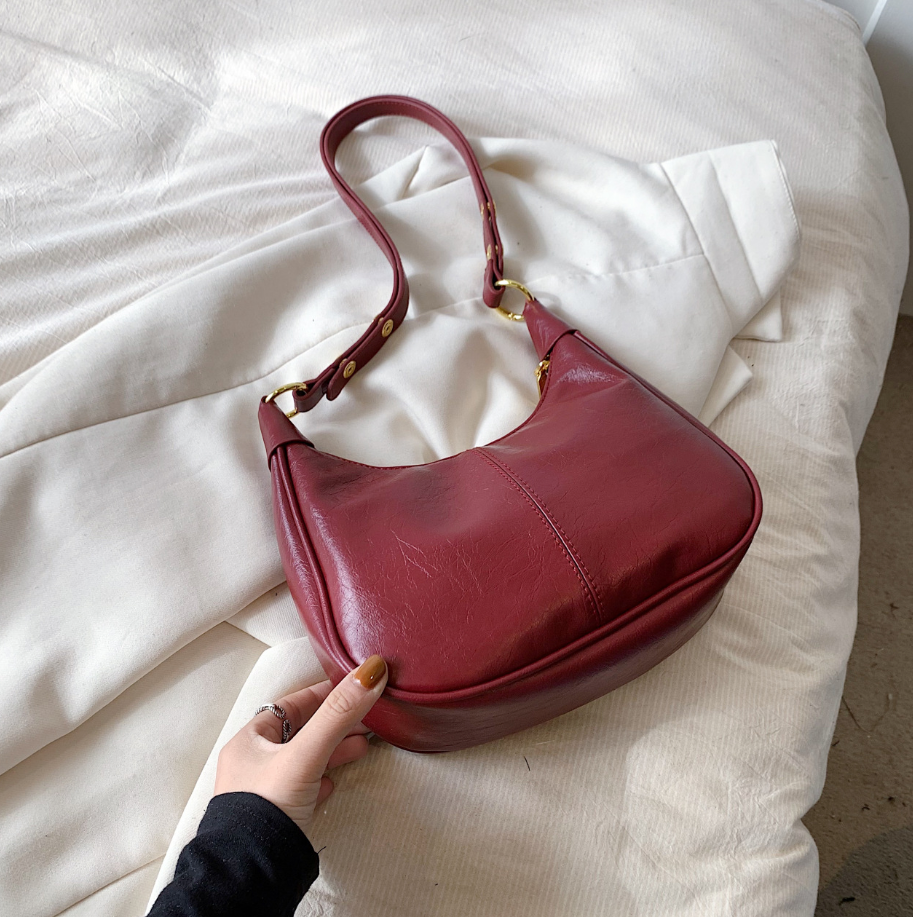 Women's structured crescent hobo bag zip-top closure adjustable strap gold hardware everyday purse