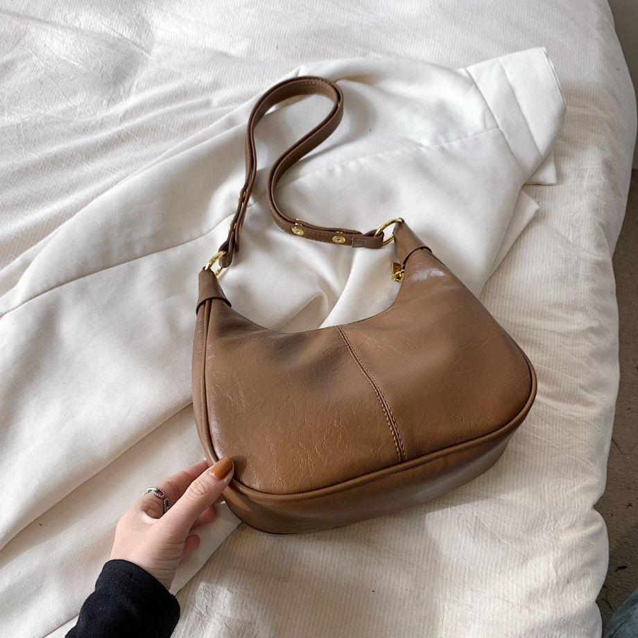 Women's hobo bag zip-top closure adjustable strap gold hardware crescent silhouette everyday purse