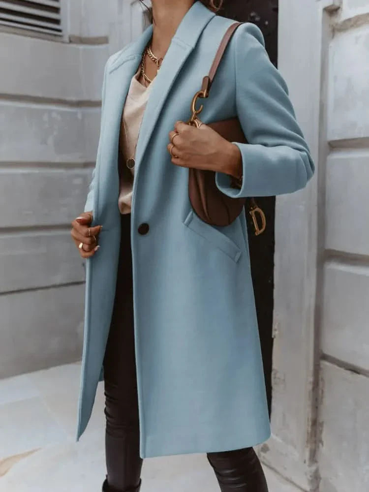 Women's long tailored overcoat structured shoulders minimalist design elegant smart layering essential